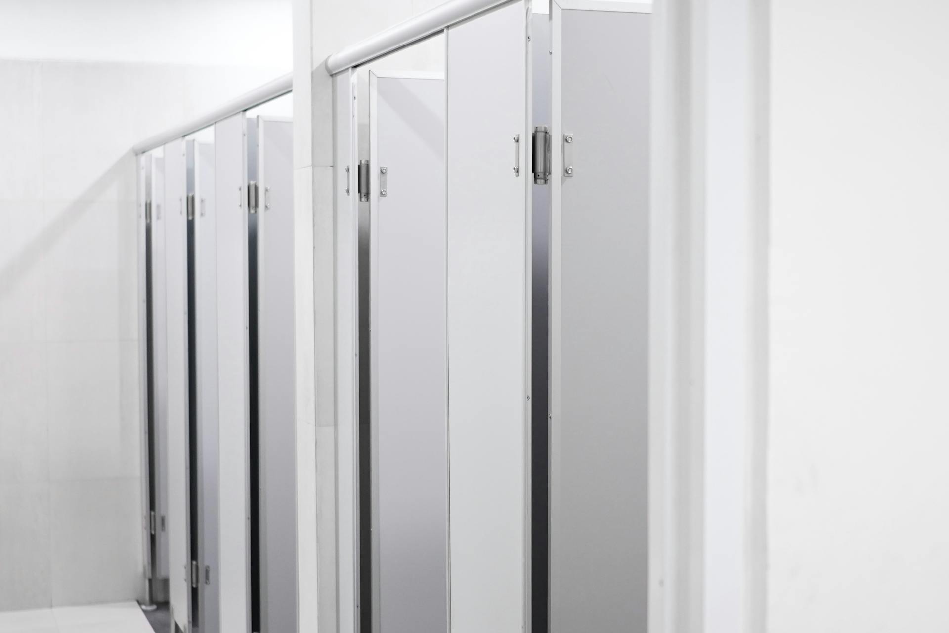 toilet stall doors in a commercial office bathroom